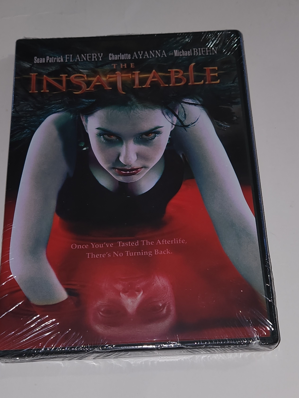 Think! The Insatiable DVD - Red & Black Cover